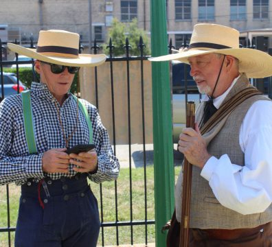Two men in cowboy attire at the George Manor